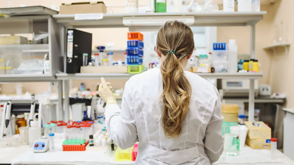 Researcher preparing experimental diets at a laboratory bench